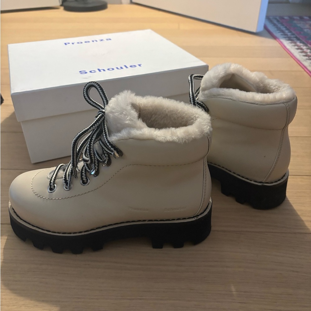 PROENZA SCHOULER
Beige Shearling Hiking Boots
Size: 37